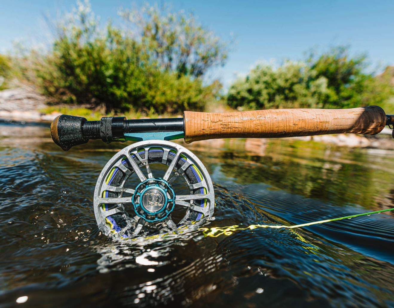 Ross Reels Evolution LTX Machinist Edition Fly Reel dunked into river
