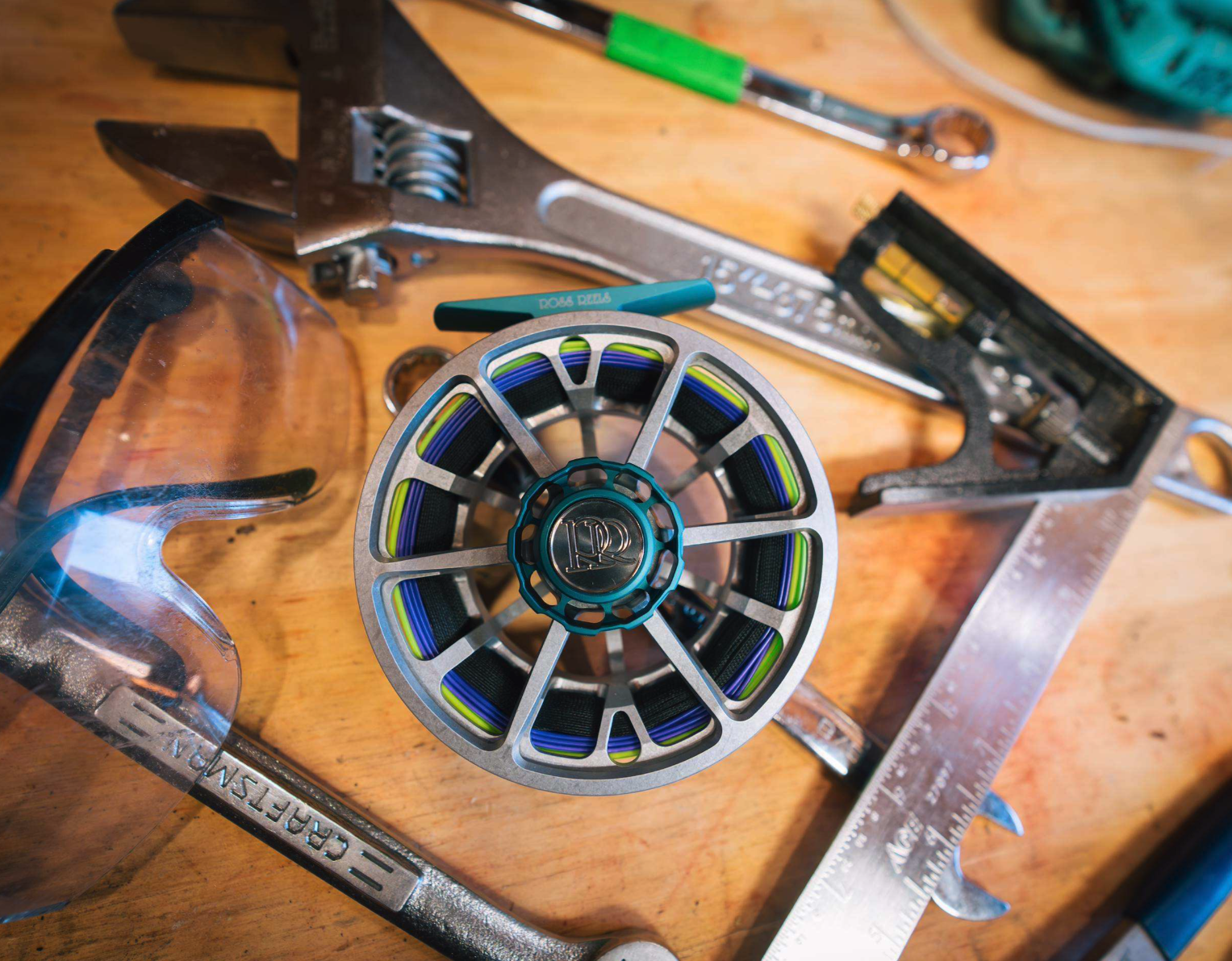 Ross Reels Evolution LTX Machinist Edition Fly Reel on table with tools