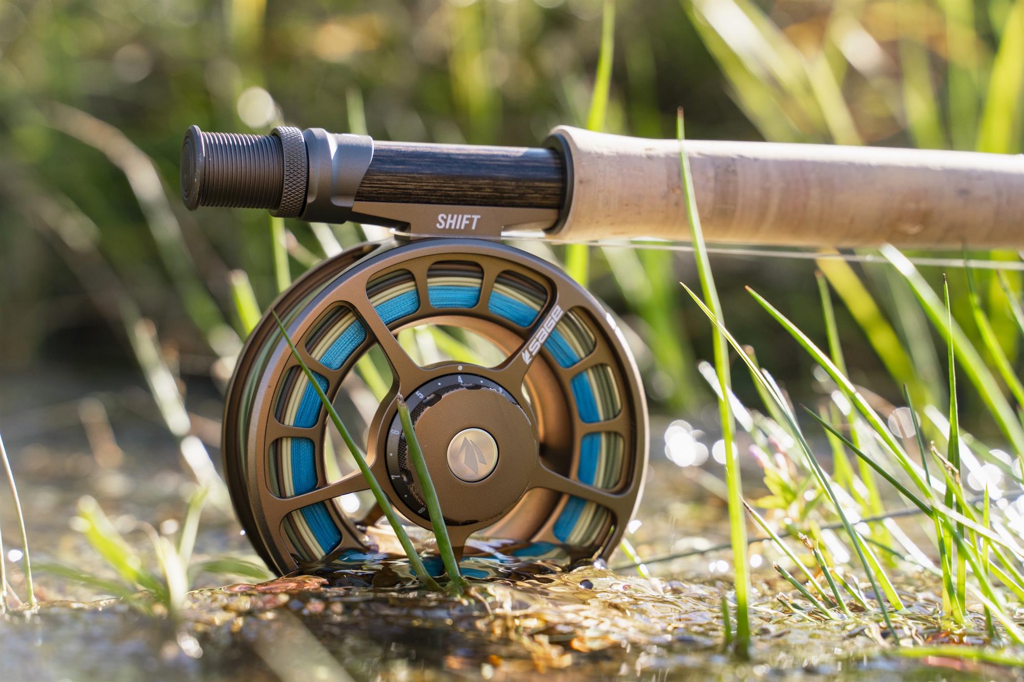 Sage ARROW Fly Rod with Sage fly reel on ground
