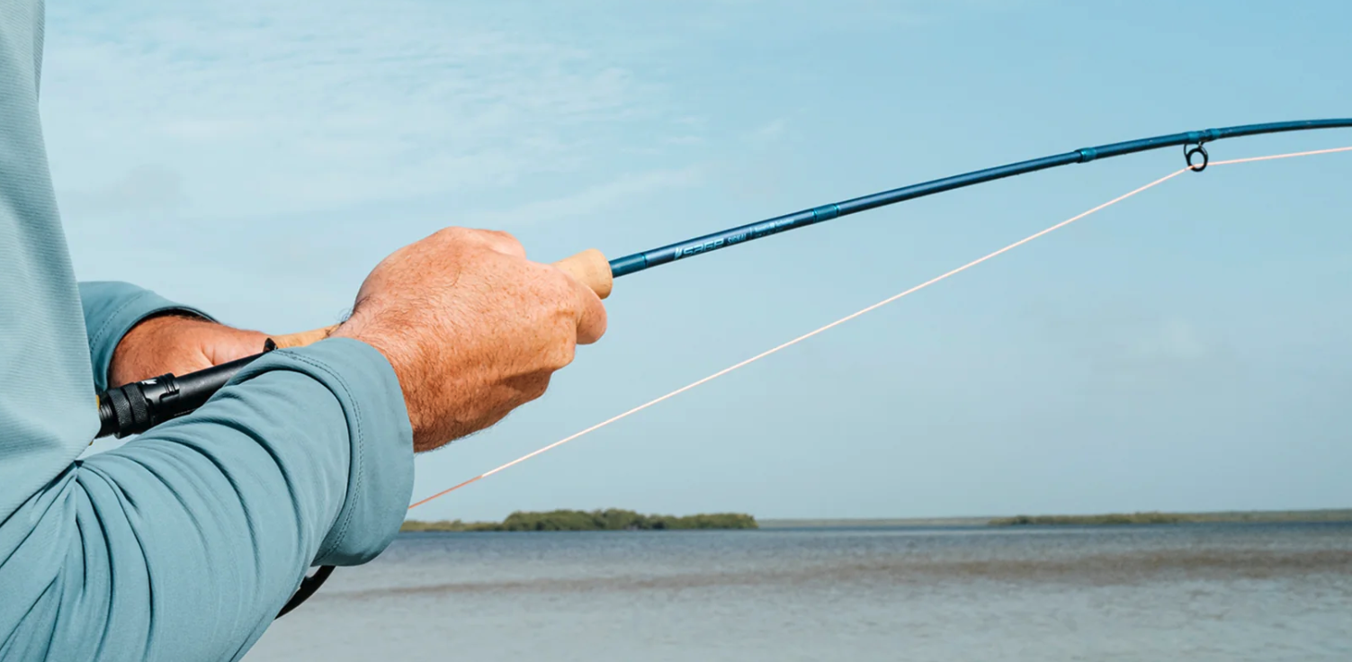 Angler fighting fish on Sage SIGNAL Fly Rod