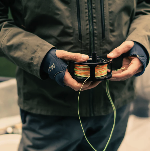 Sage SPEY 2 Reel with a spool of high-quality fly line, ready for challenging river fishing scenarios.