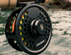 Sage SPEY 2 Fly Fishing Reel against a backdrop of a flowing river, demonstrating its suitability for freshwater spey fishing.