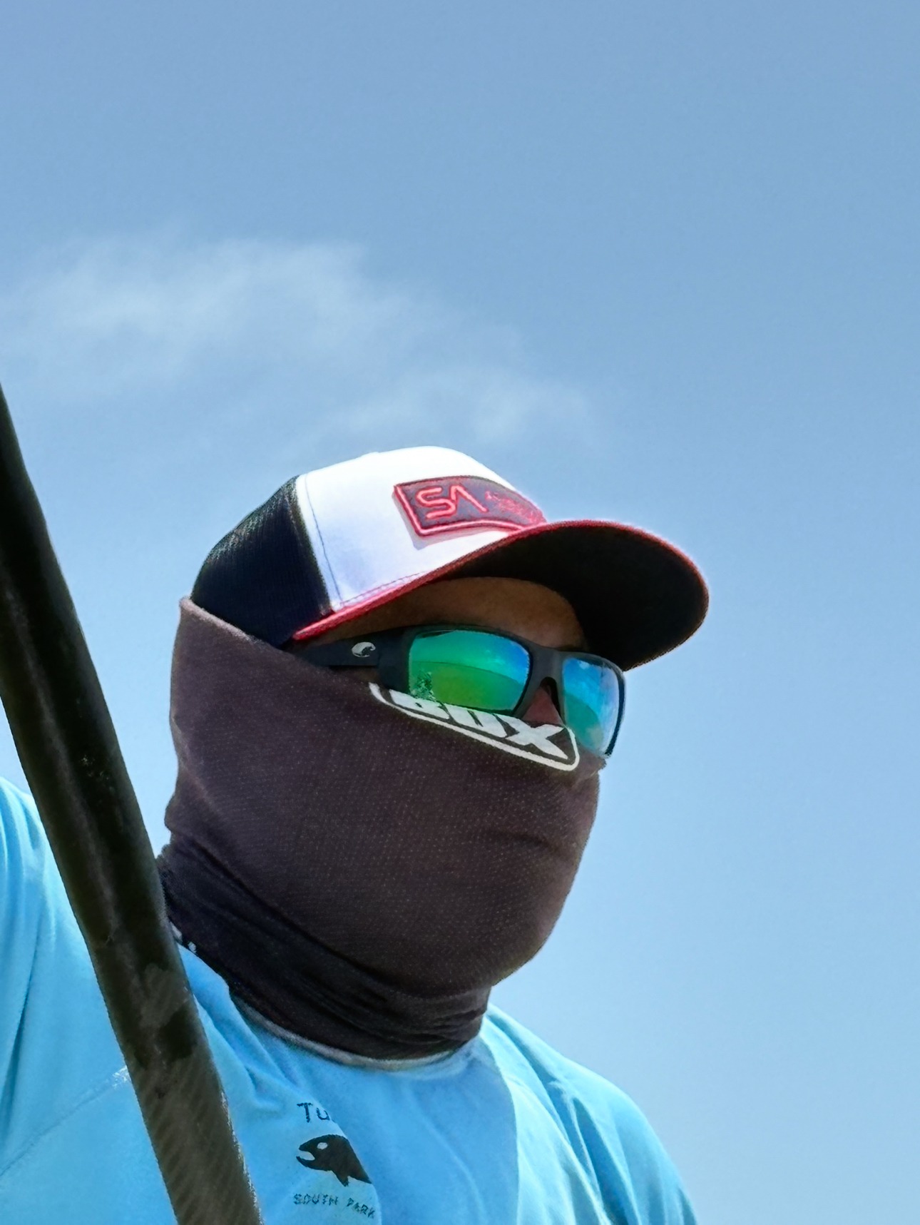 Scientific Anglers Logo Trucker Hat worn by angler outdoors for fly fishing and warm-weather use