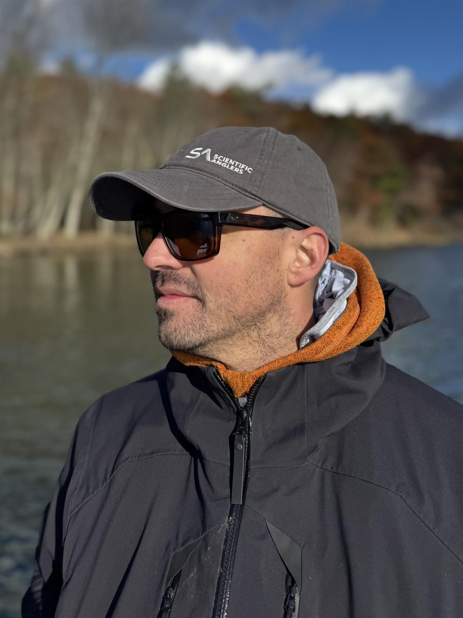 Scientific Anglers Low Profile Hat Grey low-profile fishing cap worn by angler on the water