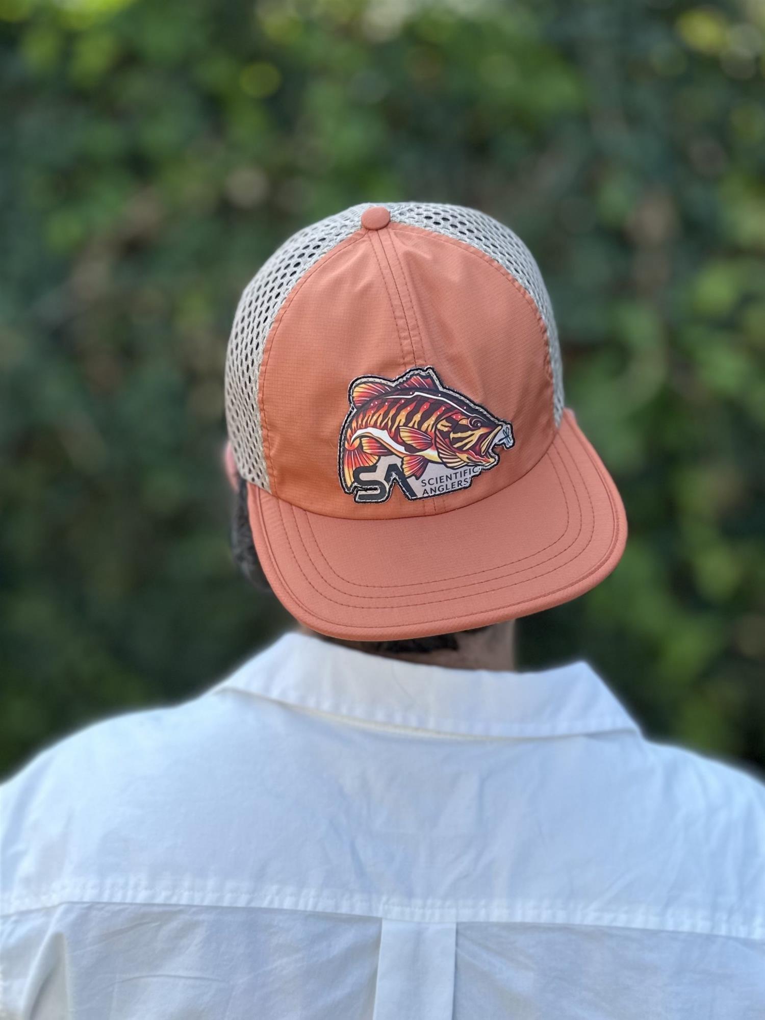 Scientific Anglers Quick Dry Packable Hat worn outdoors with breathable mesh and smallmouth bass fishing patch