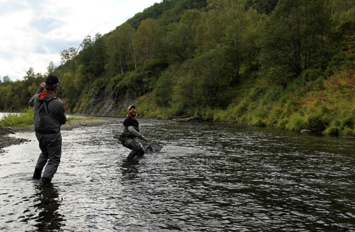 Anglers fishing in river with Scott GT Fly Rod