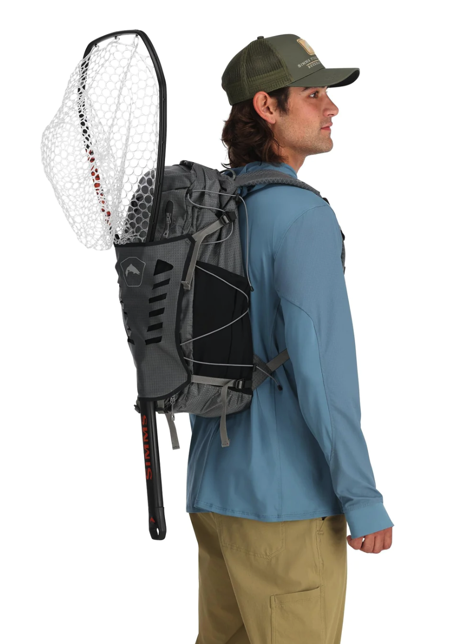 Fly fishing adventure with the Simms Flyweight Backpack for lightweight gear storage.
