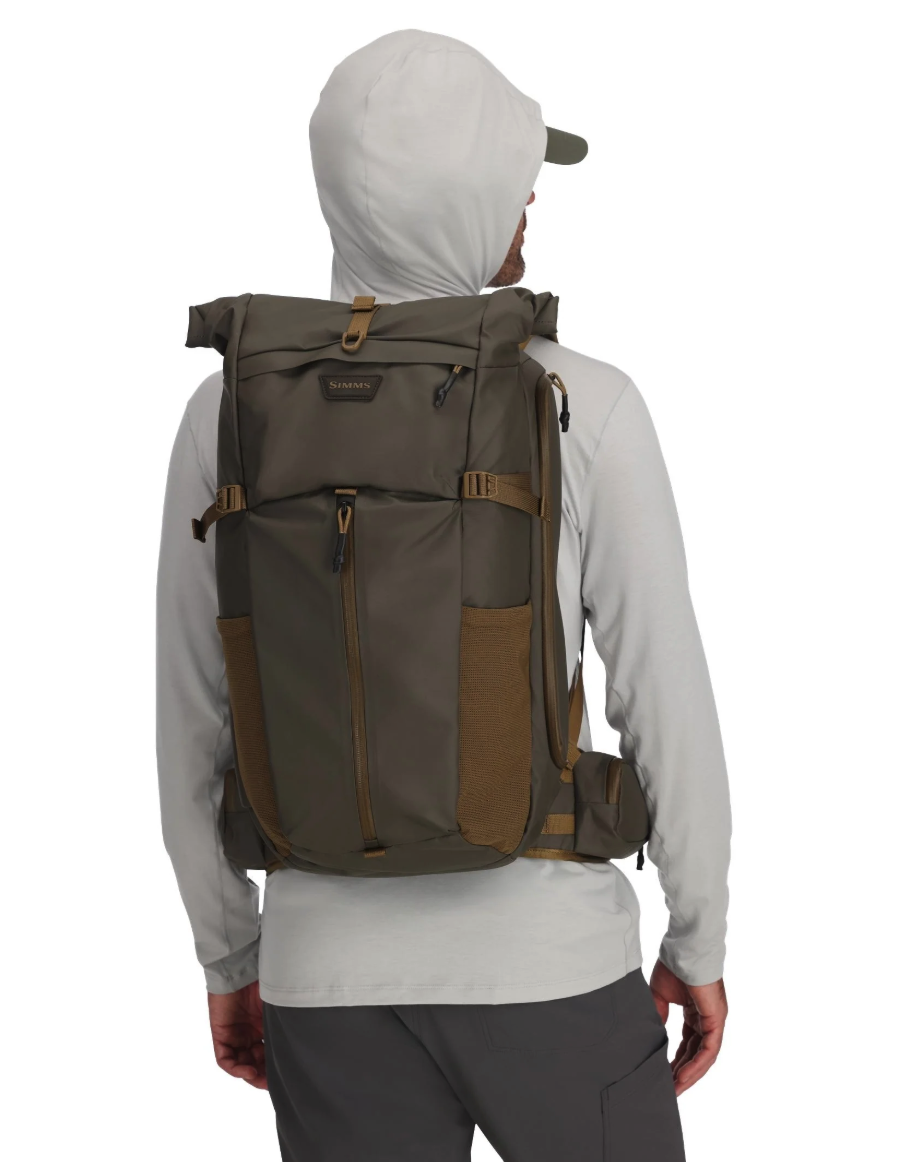Rear view of model wearing Simms Headwaters Backpack