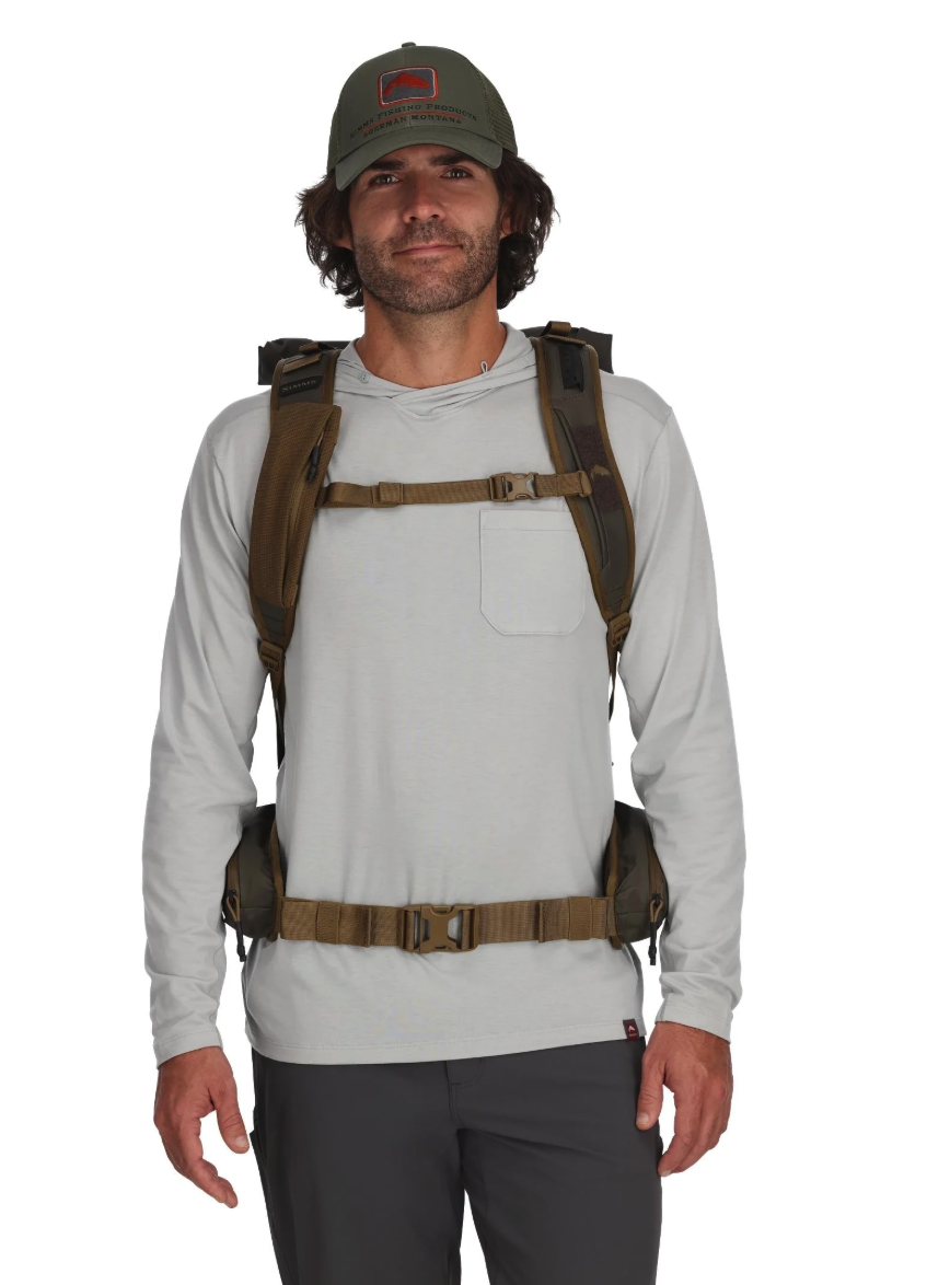 Front view of model wearing Simms Headwaters Backpack