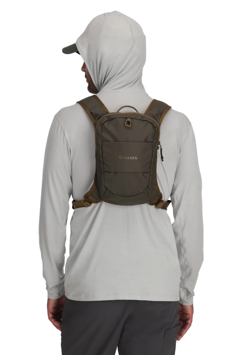 Back view of model wearing Simms Headwaters Chest Pack