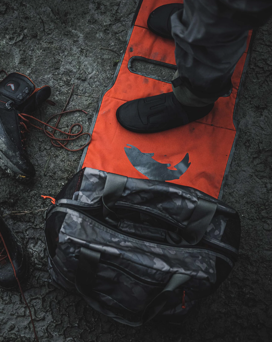 Water-resistant Simms Wader Tote with large accessory pocket and internal key clip.