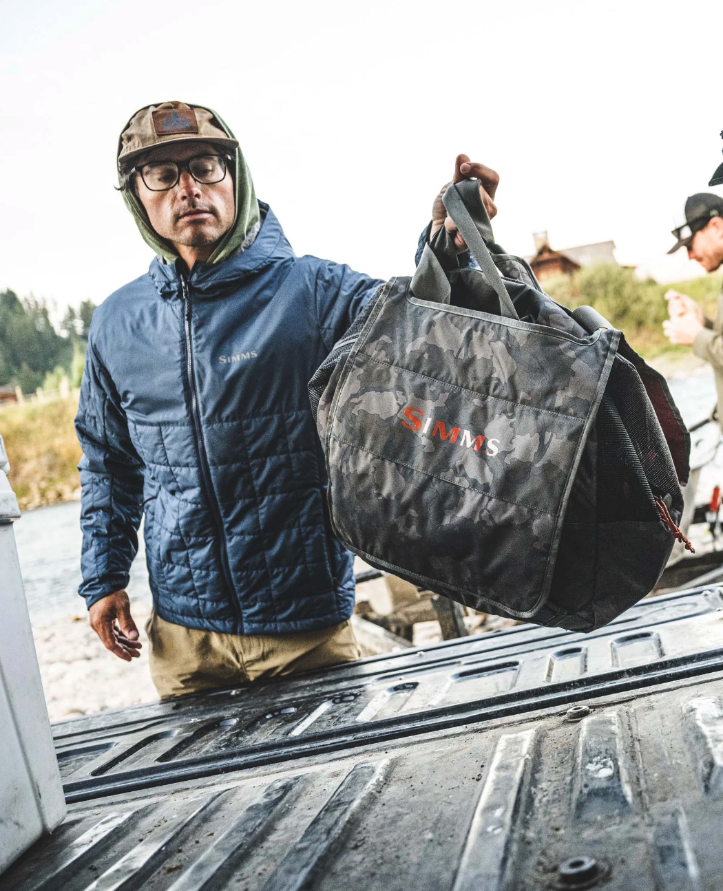 Simms Riverkit Wader Tote, durable 600D polyester, perfect for organizing fishing gear.