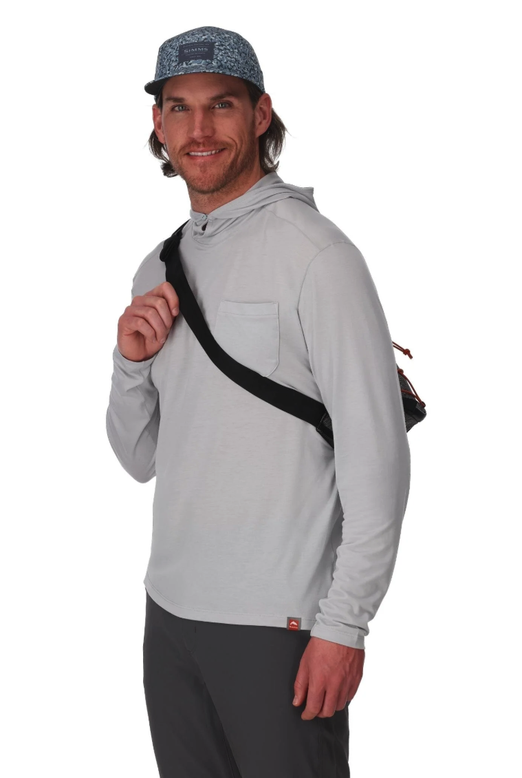 Front of model wearing Simms Scout Hip Pack as sling
