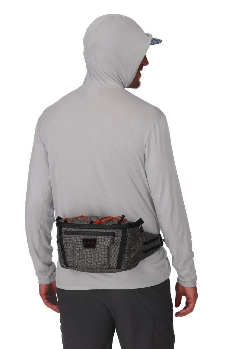 Back of model wearing Simms Scout Hip Pack