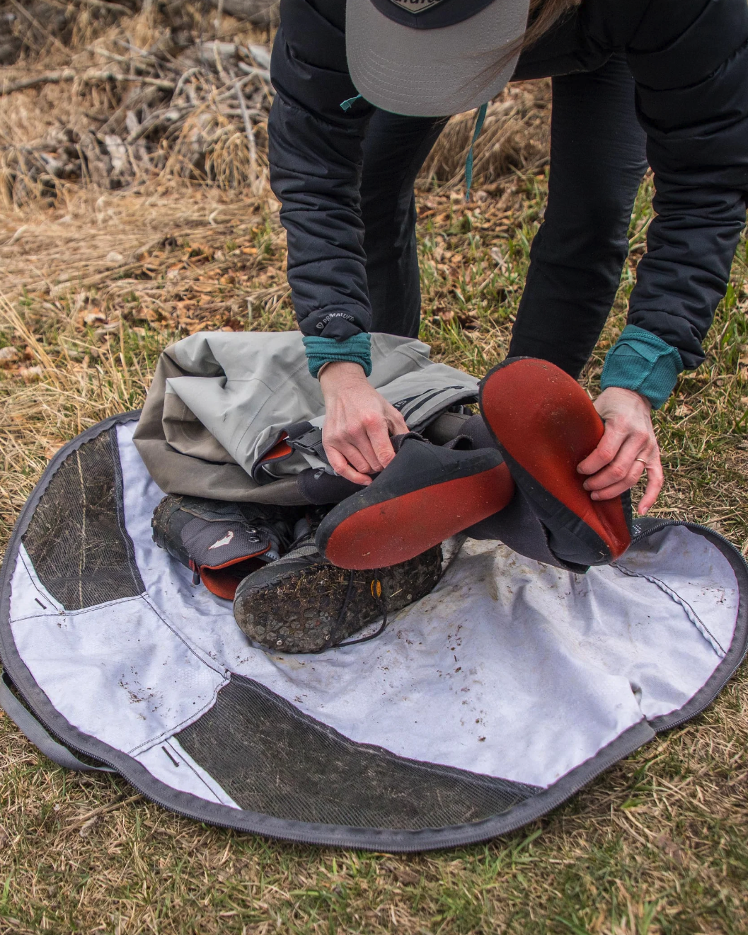 Simms Taco Bag keeps vehicles clean by containing wet boots and waders.