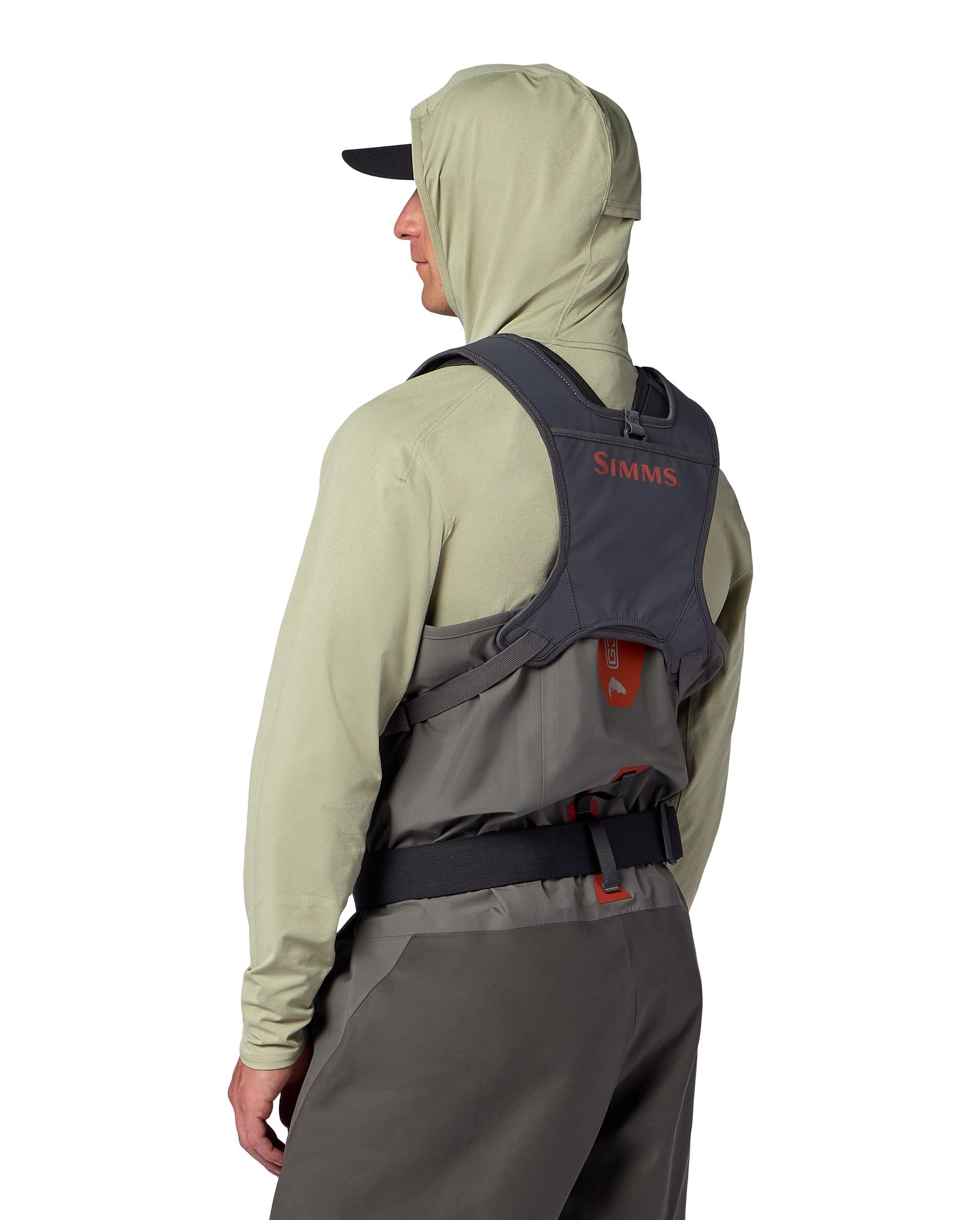 Simms Tributary Chest Pack worn with integrated rear net holder while fly fishing in waders
