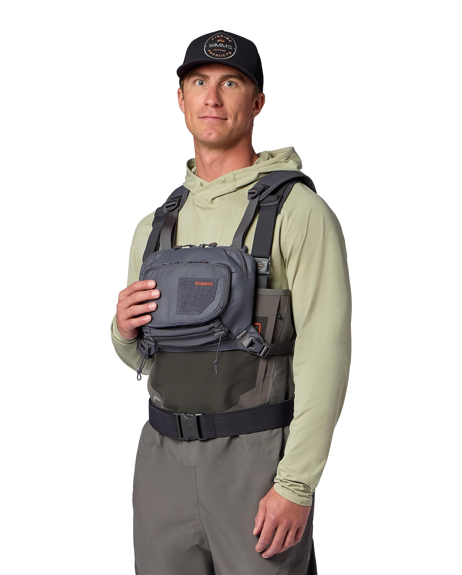 Simms Tributary Chest Pack worn while fly fishing with waders for day-trip use
