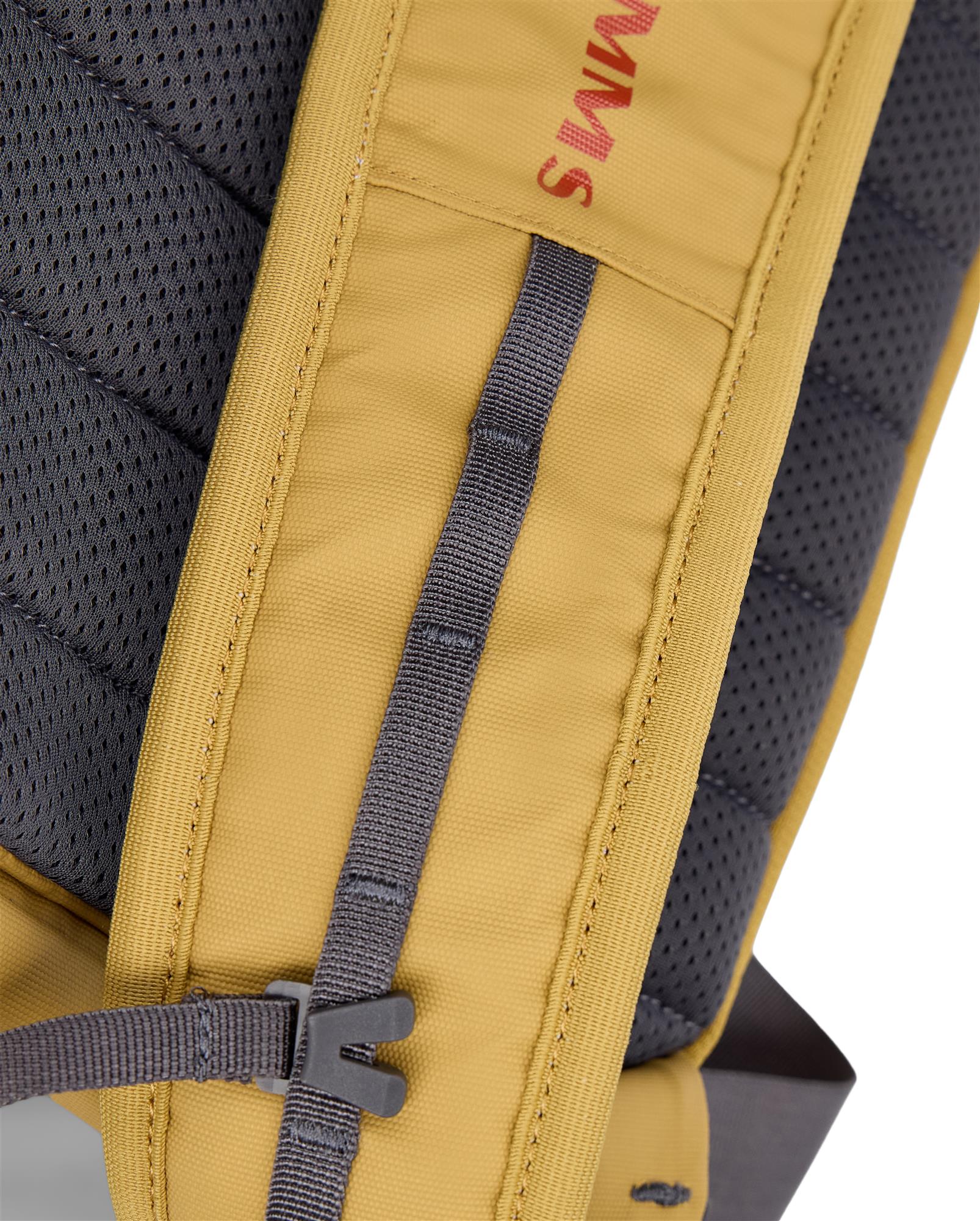 Close-up of Simms Tributary Sling Pack shoulder strap adjustment buckle and webbing attachment