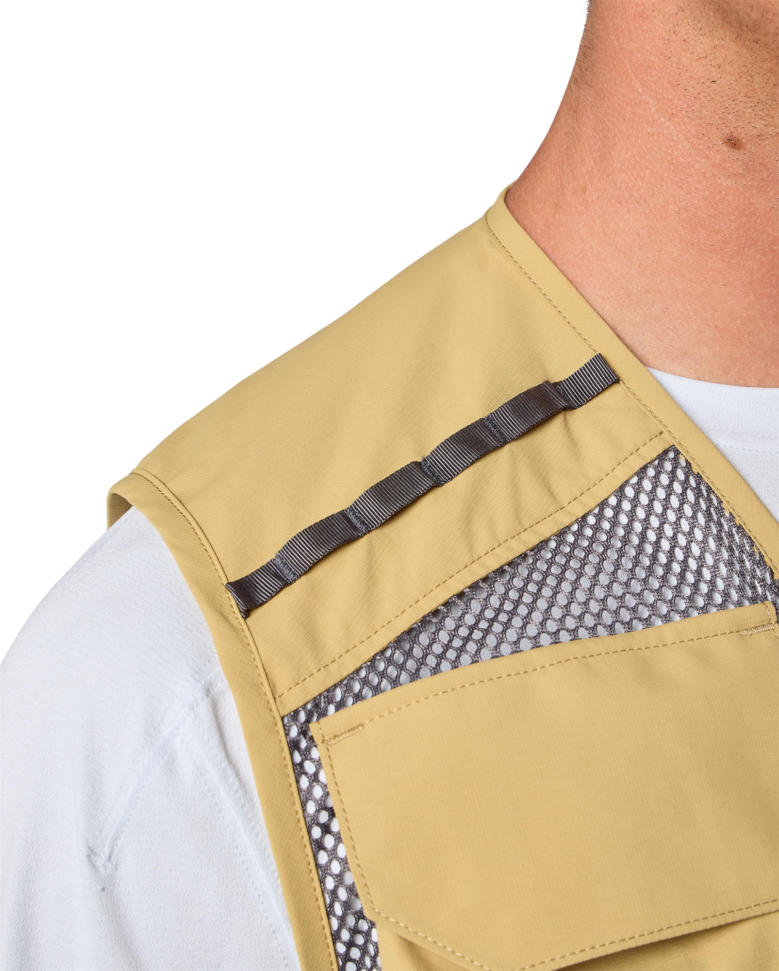 Lightweight trout fishing vest with fly patch and tool docking system