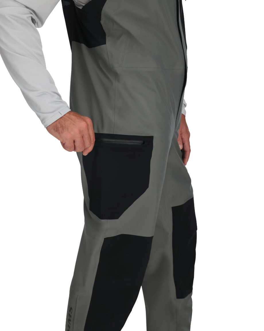 Side pocket detail of Simms Vapor Elite Bibs on model