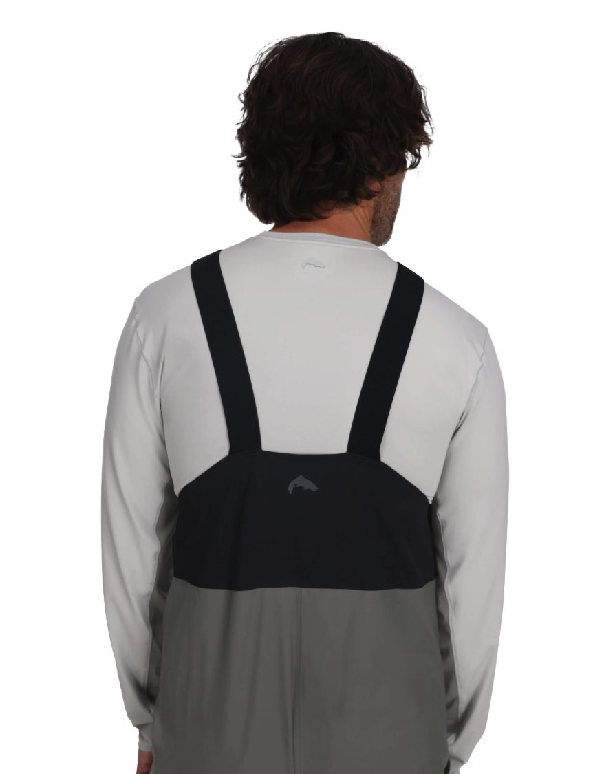 Model wearing suspenders of Simms Vapor Elite Bibs