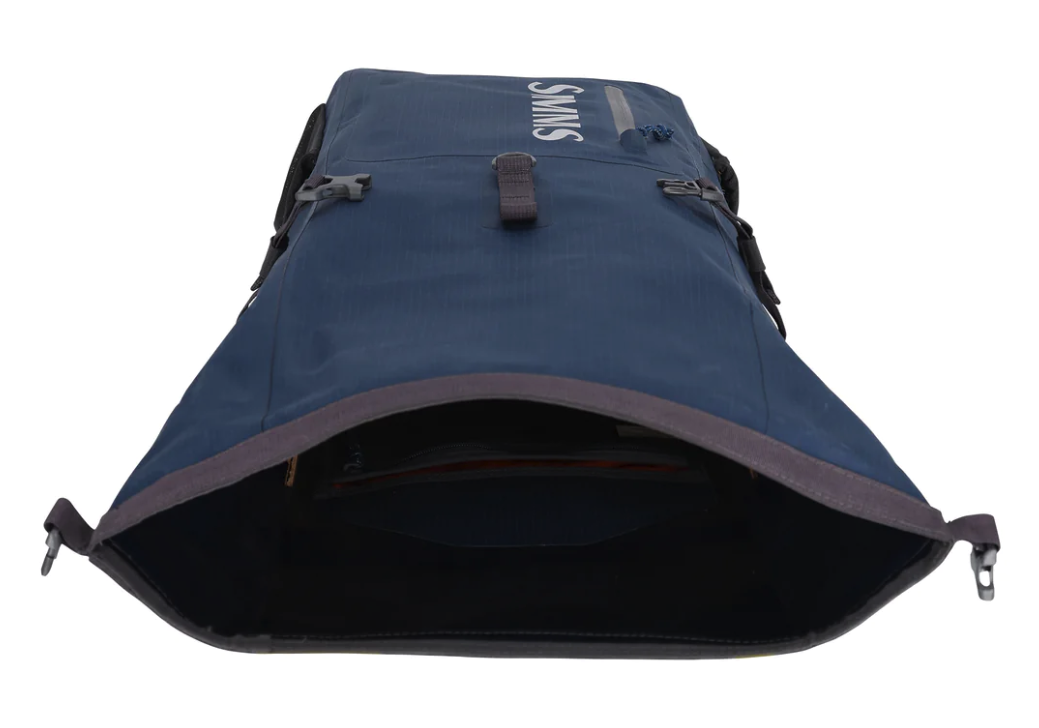 Fishing gear protected with Simms Dry Creek Roll Top Backpack, outdoor and fishing bag.