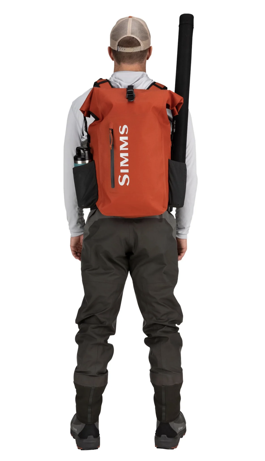 Waterproof Simms fishing backpack with roll-top design for secure storage.
