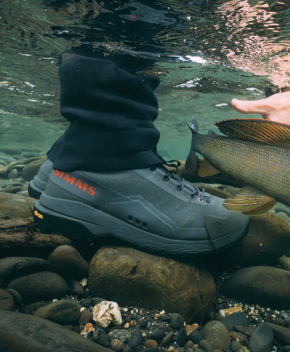 Simms Flyweight Wading Boots Vibram in river water.