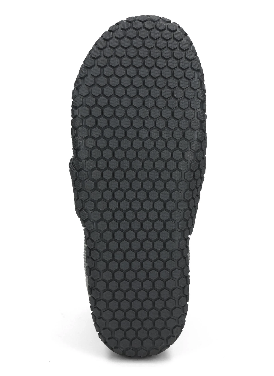 Side view of Simms ZipIt Flats Booties showcasing their non-slip sole for reliable traction on slippery saltwater flats.