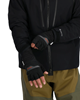 Model putting on Simms Windstopper Half-Finger Fishing Glove