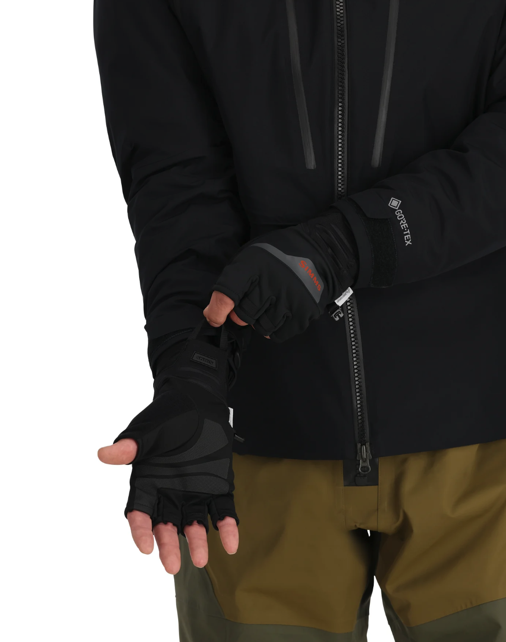 Model putting on Simms Windstopper Half-Finger Fishing Glove with palms facing up