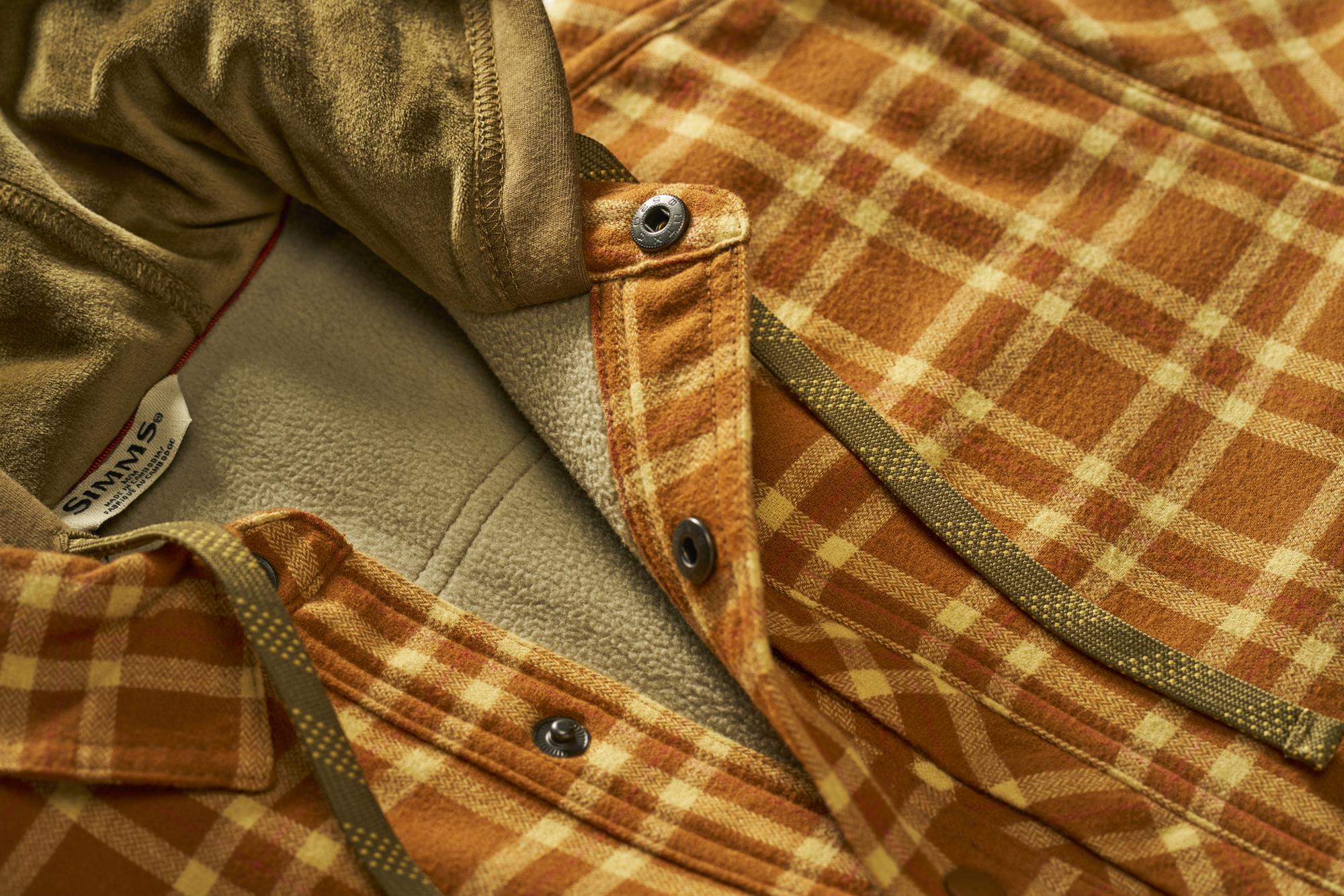 Close-up of Simms Coldweather Hooded Shacket fleece lining and snap closure