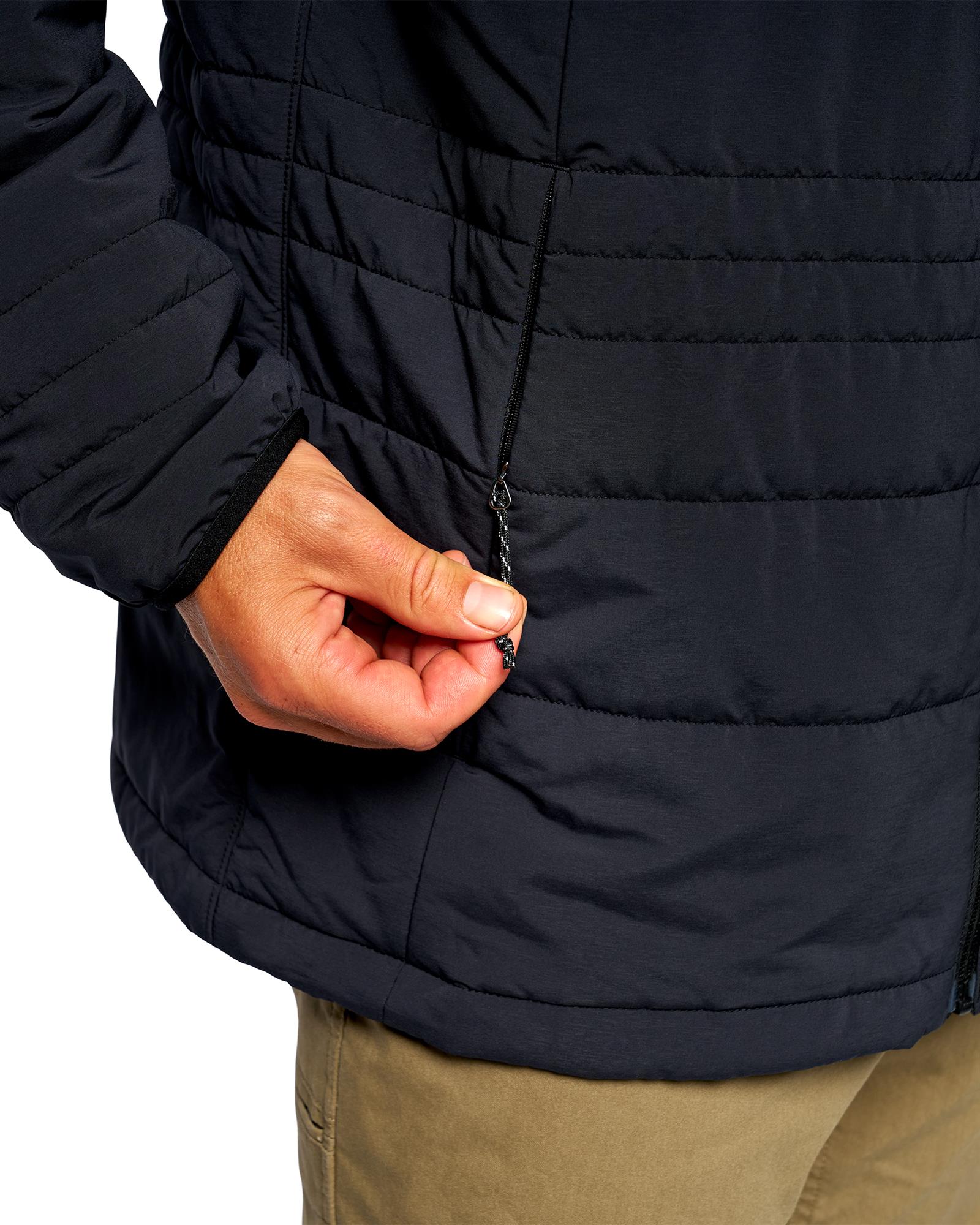 Secure zippered pocket on Simms insulated fishing jacket for outdoor gear storage