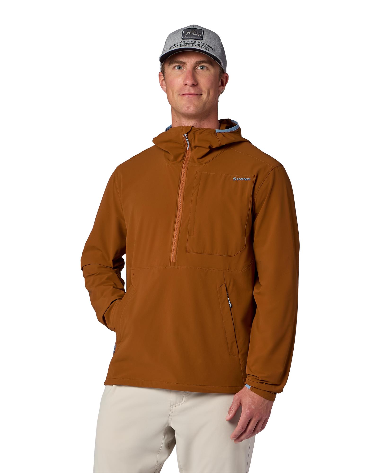 Angler wearing Simms Rogue Flex Half-Zip Pullover, lightweight windproof fishing layer for cool weather