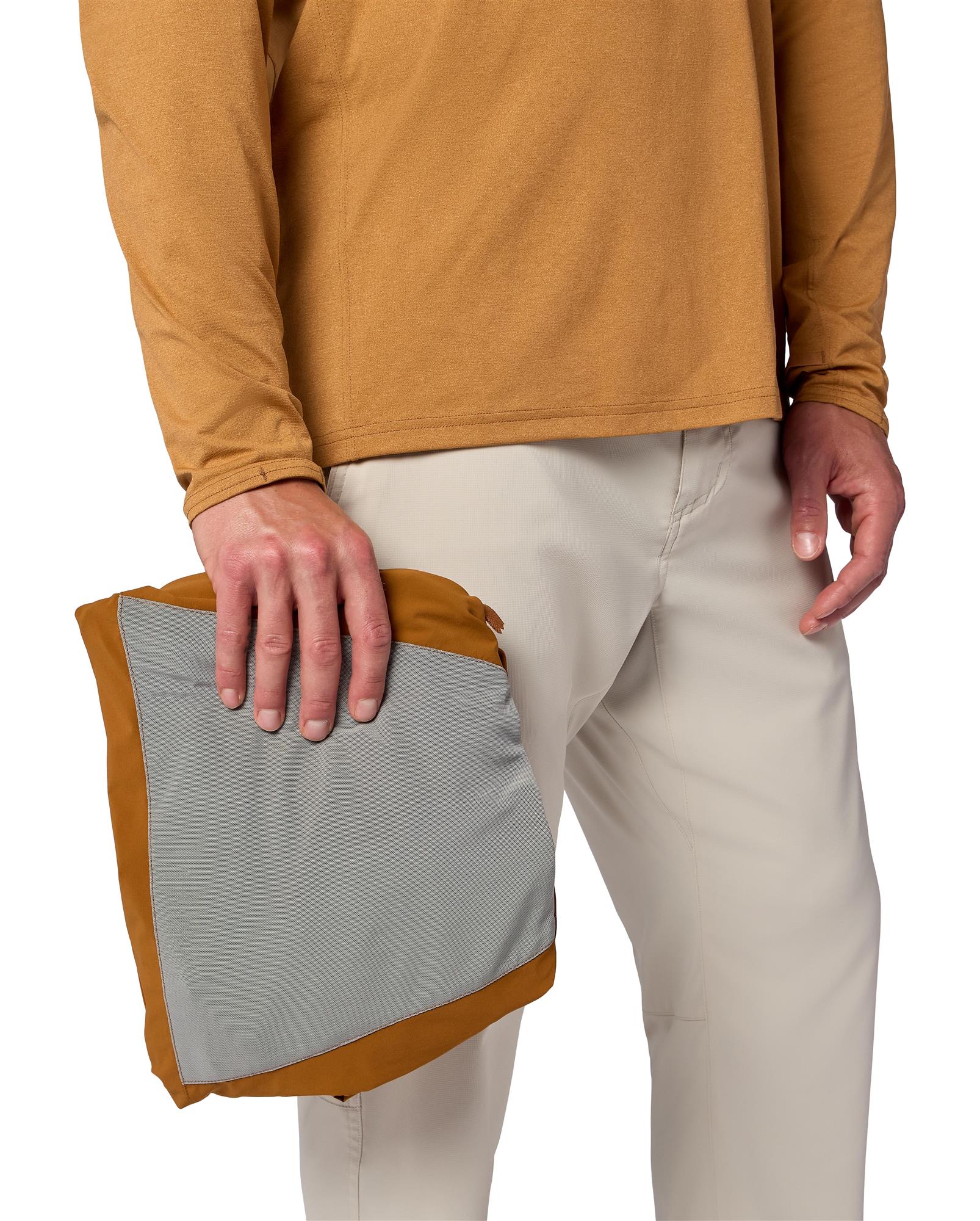 Packable Simms Rogue Flex pullover in interior stuff pocket, travel-ready fishing outer layer