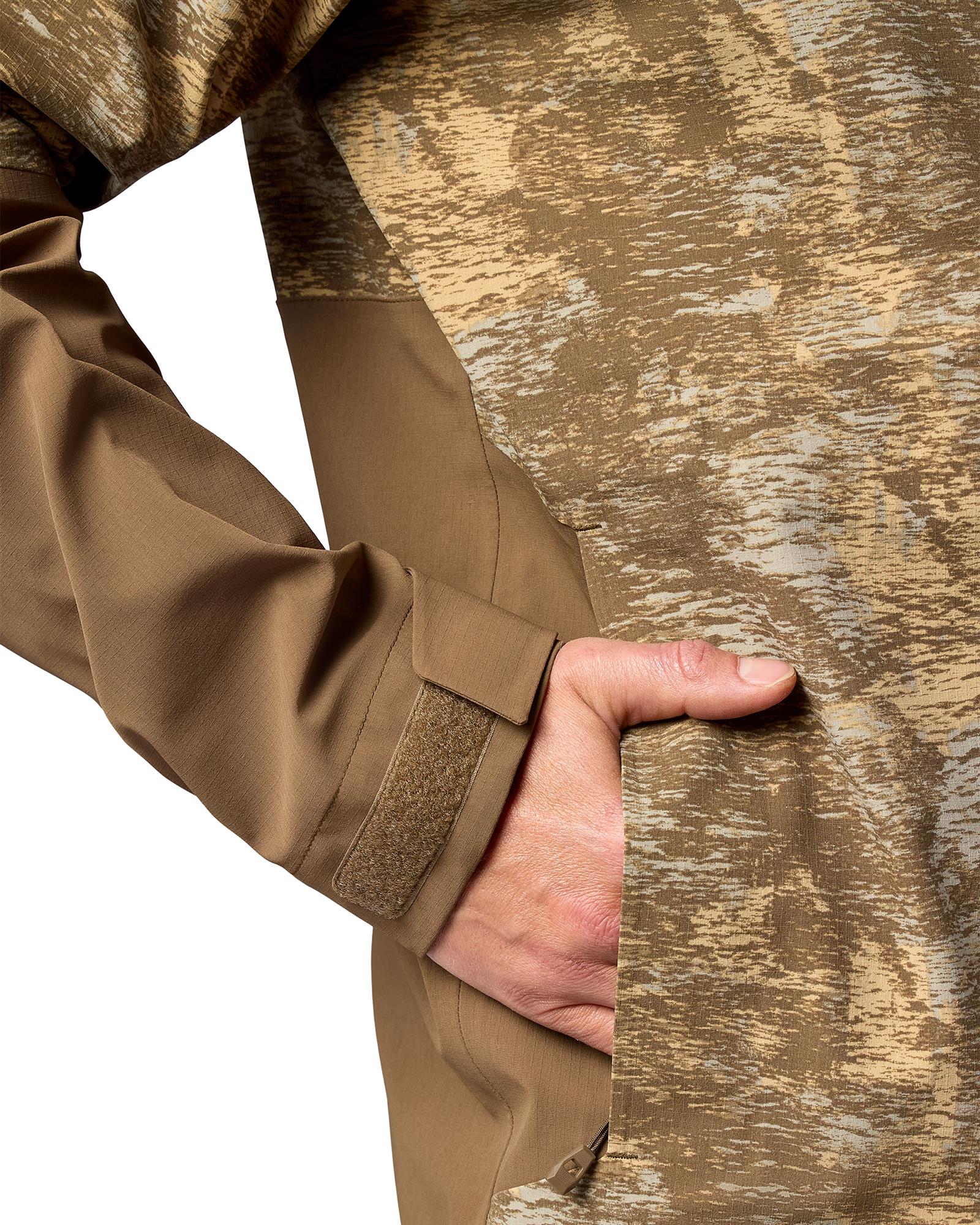 Simms Challenger Jacket waterproof fishing rain gear hand pocket and Velcro adjustable cuff