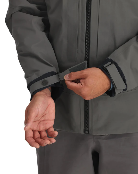 Durable Simms rain jacket with a reinforced shoulder design for heavy gear.