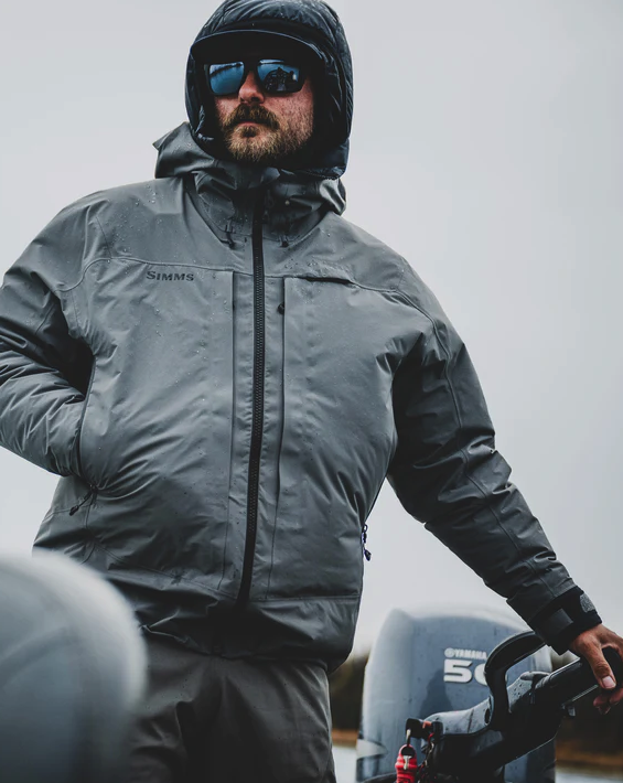 Simms fishing rain jacket with a 3-point adjustable storm hood.