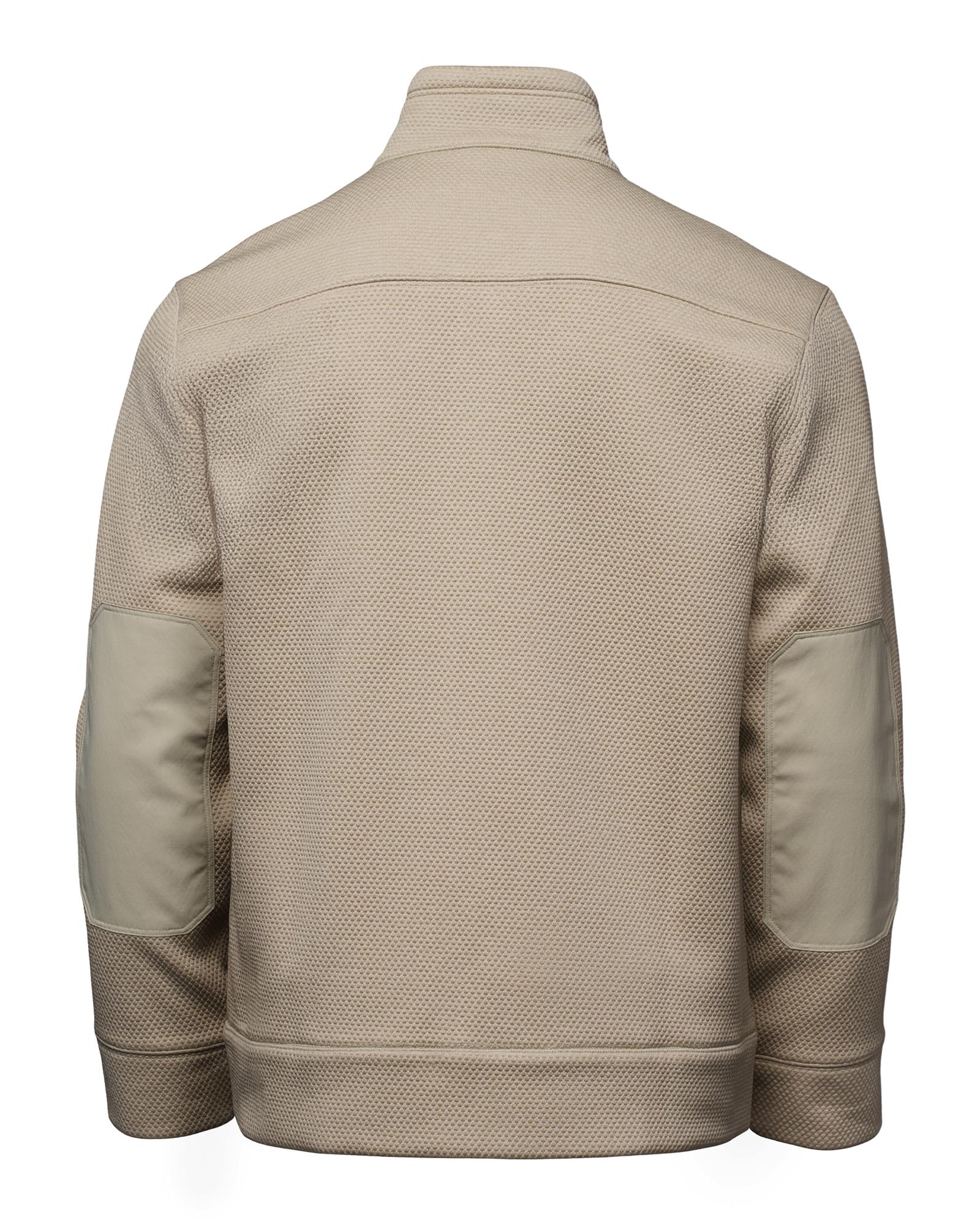 Simms Harbor Fleece fishing jacket in light tan, back view showing reinforced elbow patches and textured fabric