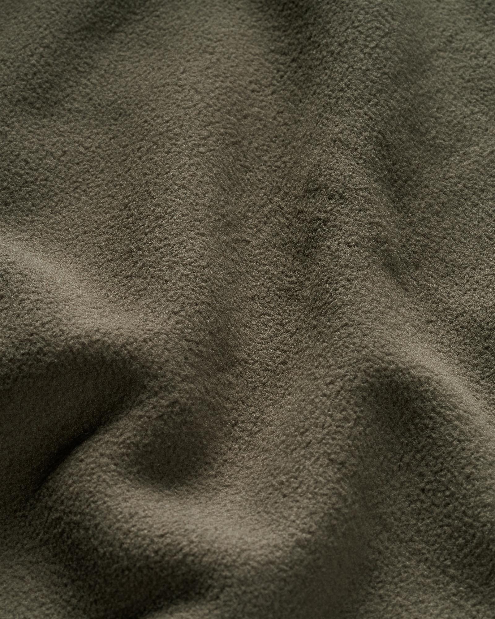 Soft stretch fleece detail on the Simms Harbor Fleece jacket for cool-weather fishing and camping
