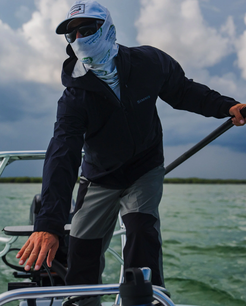 Angler on poling tower wearing Simms Vapor Elite Jacket