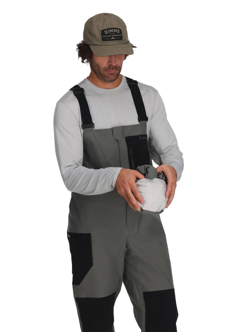 Model with bibs packing Simms Vapor Elite Jacket