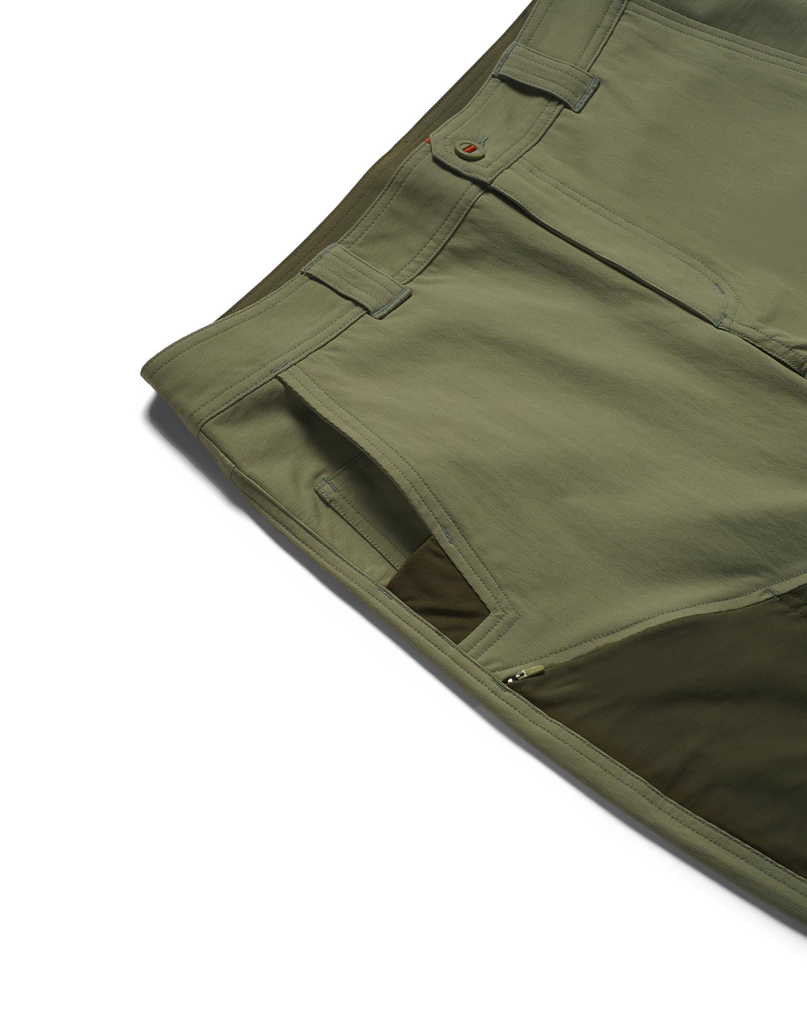 Simms fishing pants close-up with durable waistband belt loops and accessible hand pocket