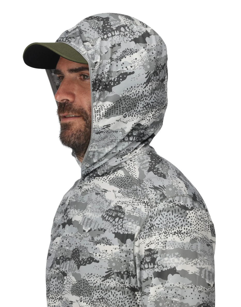 Model wearing Simms BugStopper SolarFlex Hoody with hood up.