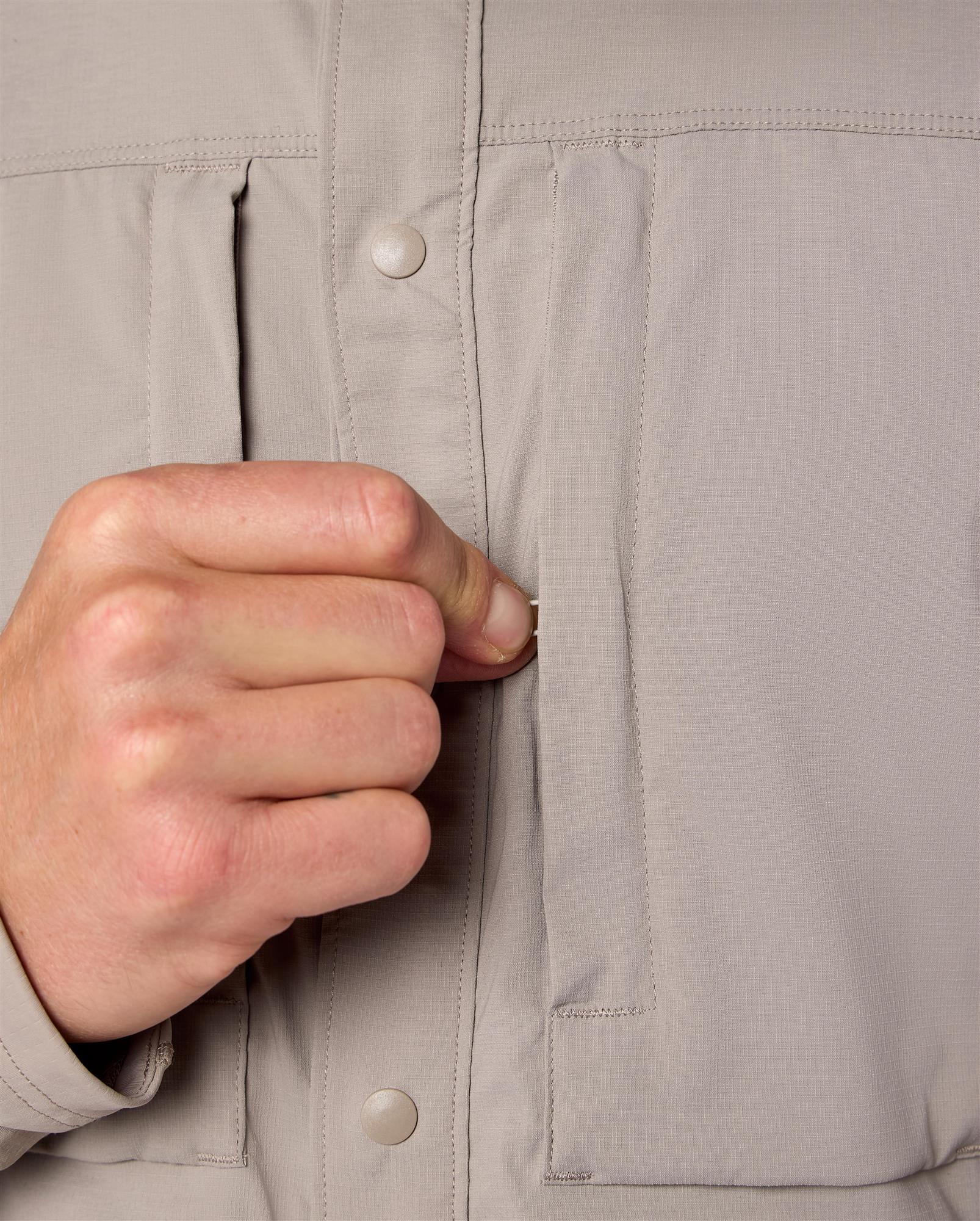 Simms Latitude BiComp Hoody detail showing snap buttons and chest pocket design