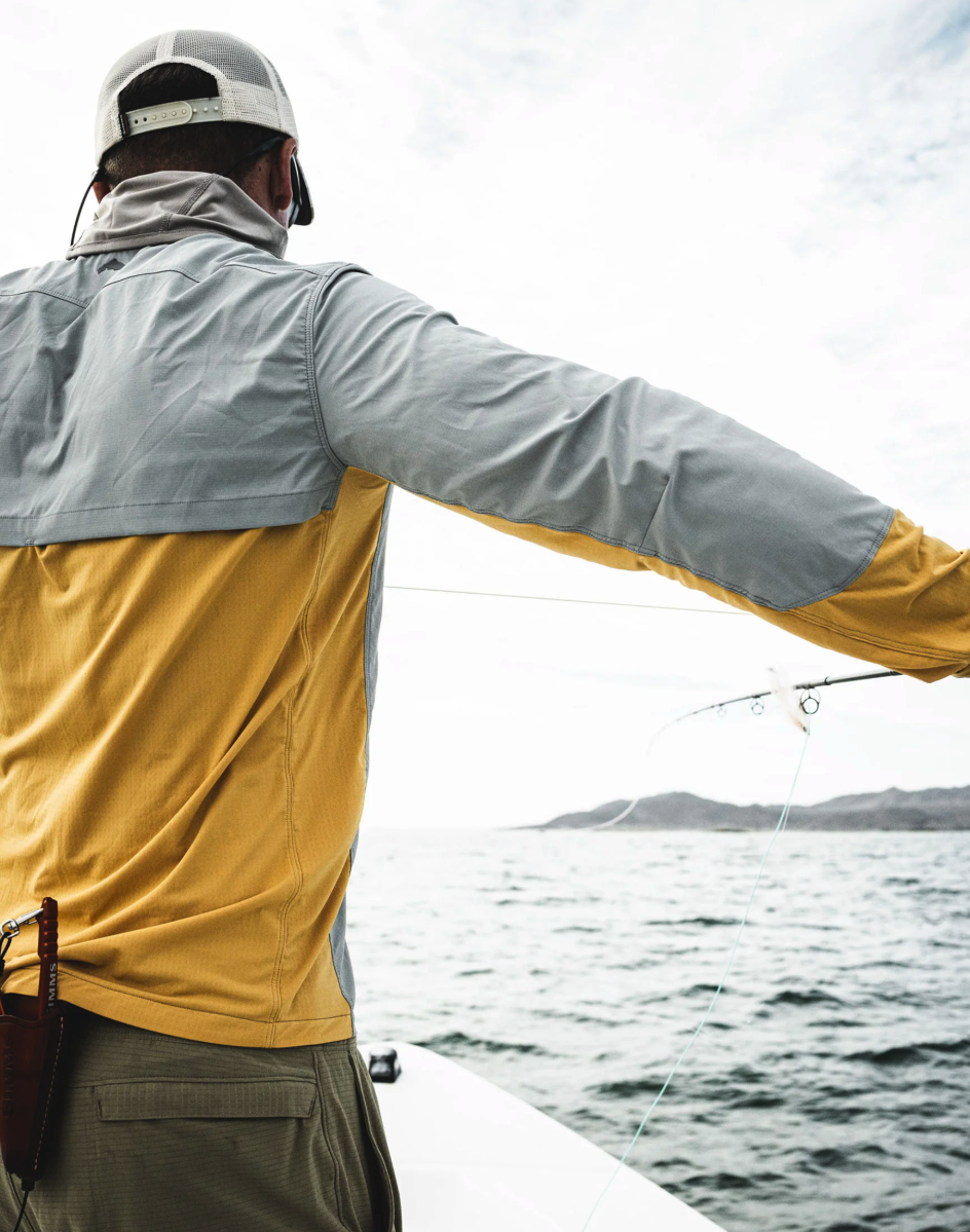 Back of angler wearing Simms Latitude BiComp Shirt