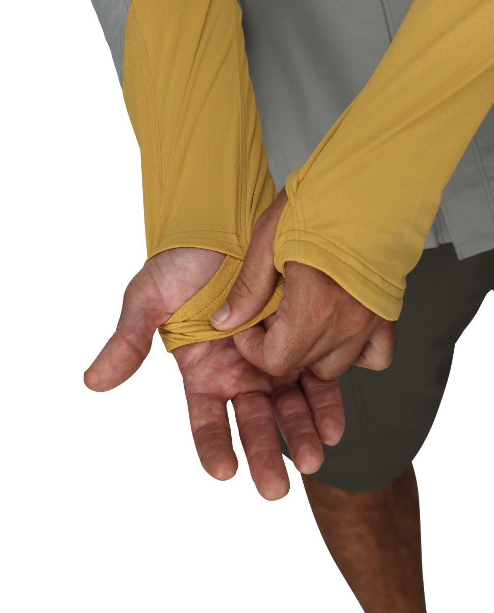 Model hand strap detail on Simms Latitude BiComp Shirt