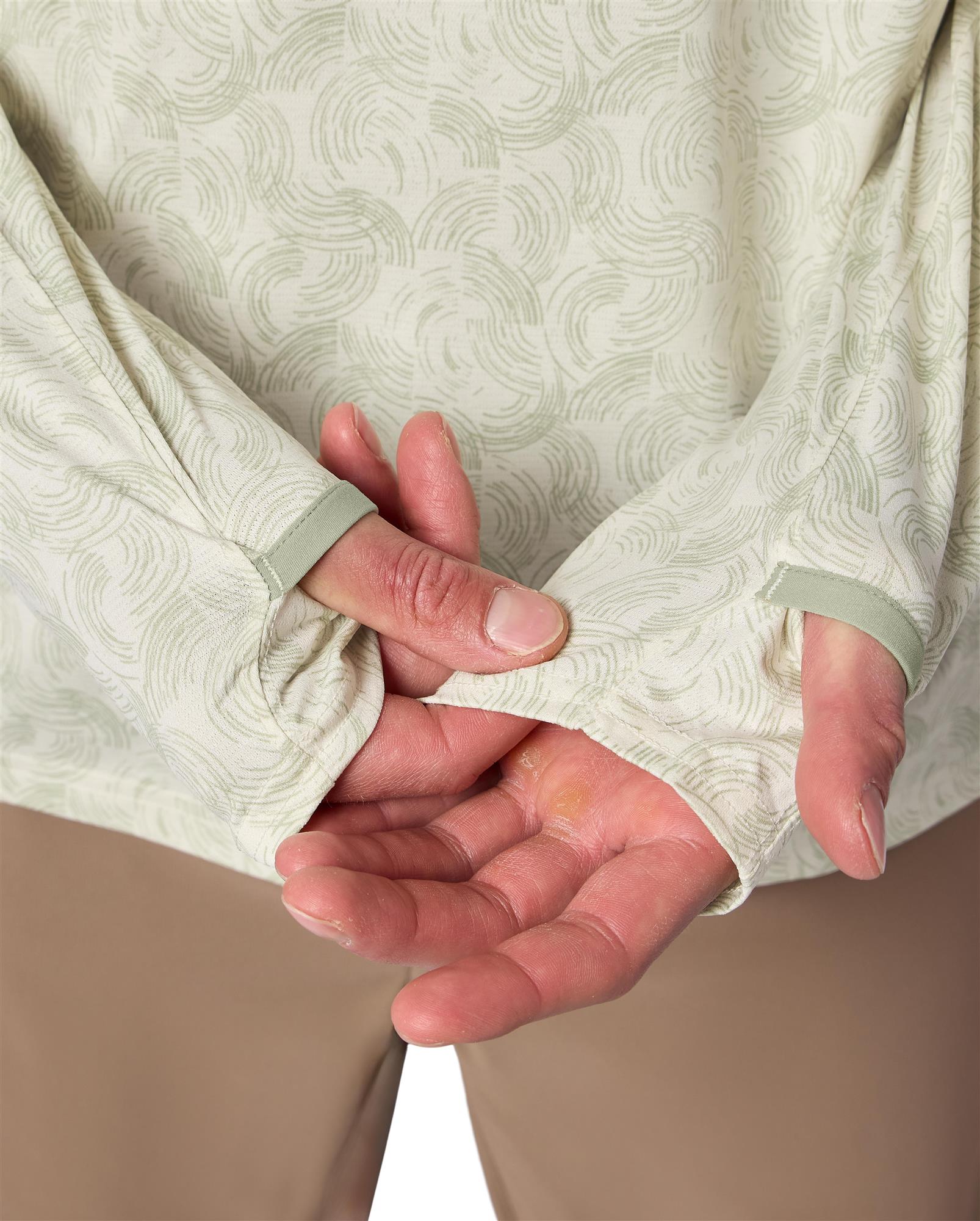 Close-up Simms Solarflex Crewneck thumbhole and finger loop hand sun protection feature