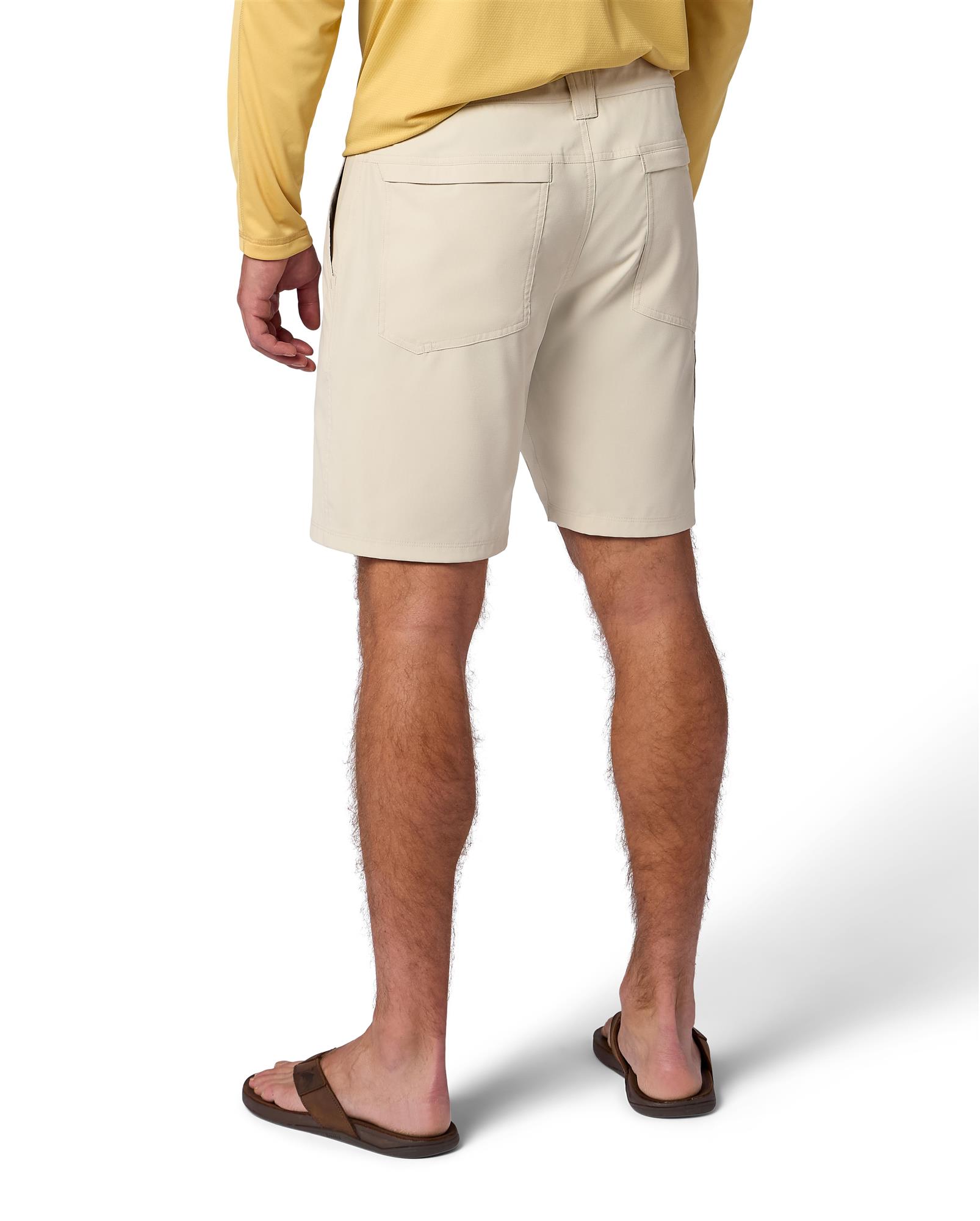 Simms Superlight Short men’s fishing shorts back view on model