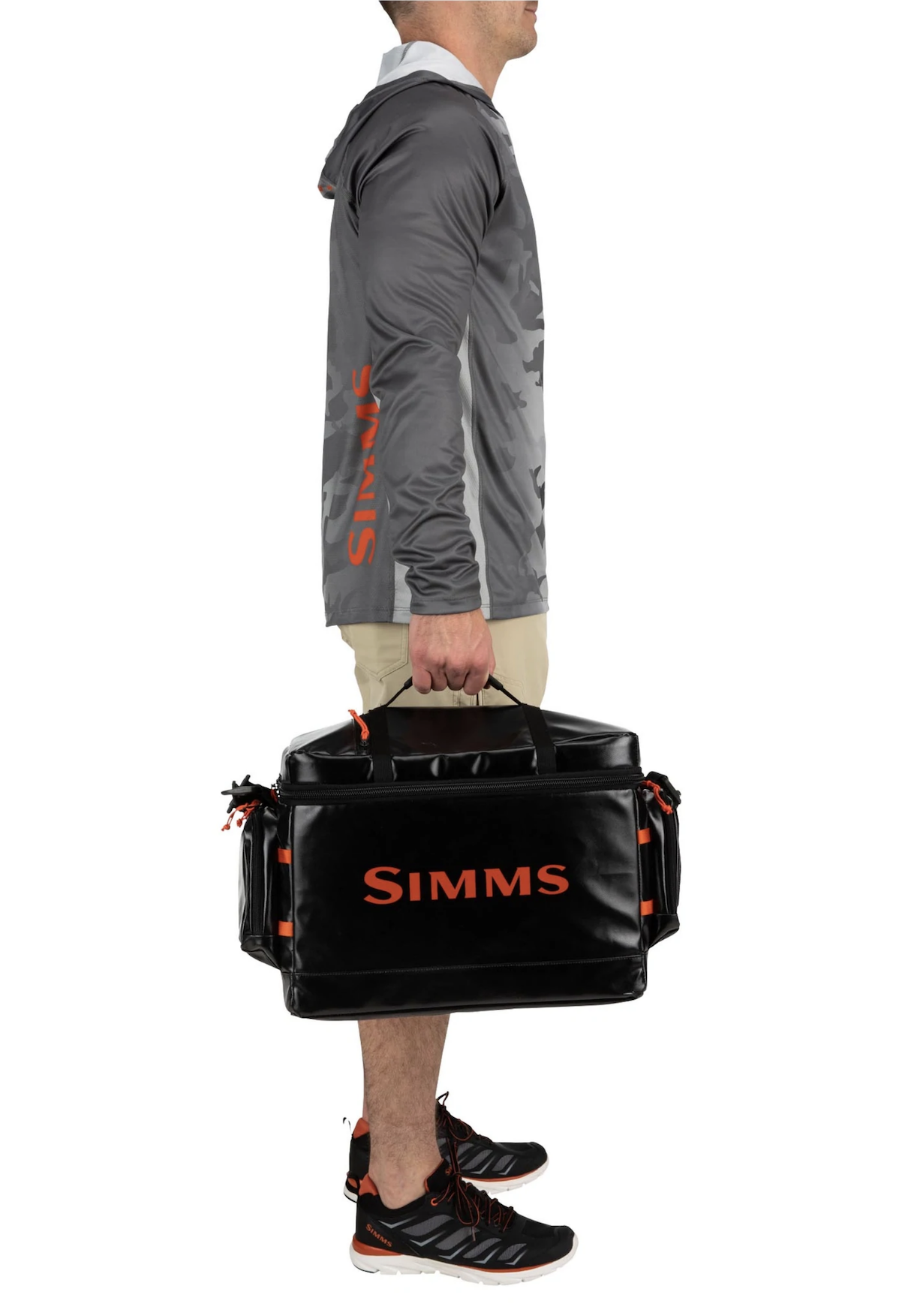 Simms Stash Bag showcasing multiple zippered accessory pockets and laser-cut lash ports